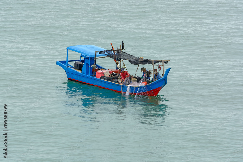 Fishermen in motor boat