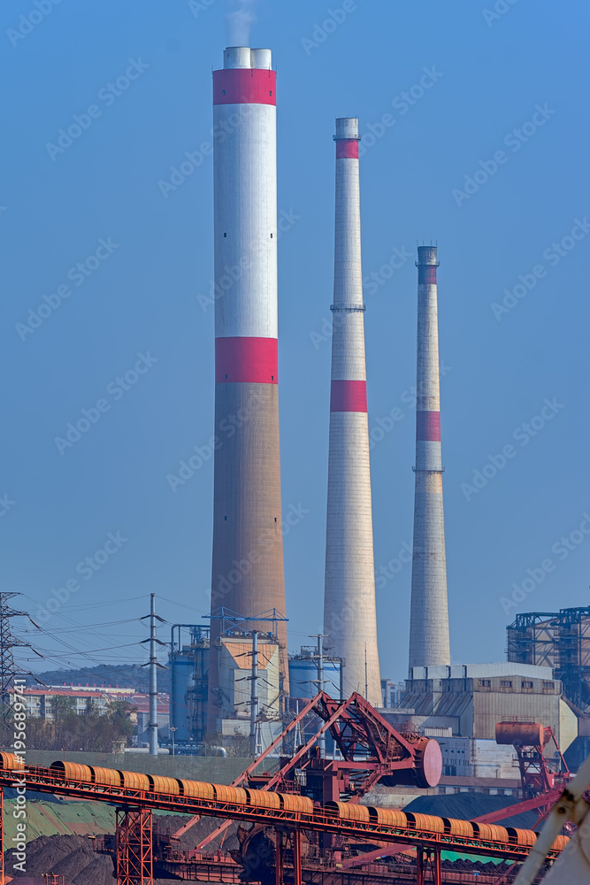 Obraz premium Smoke stacks of coal-fired power station