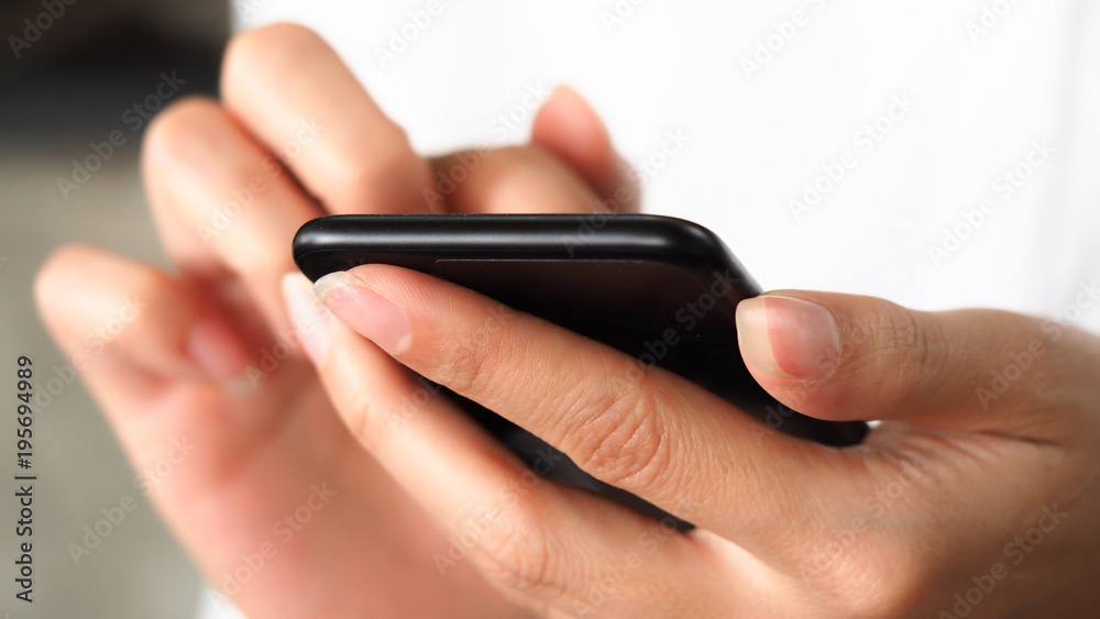 Closeup business woman hand using smartphone for connecting internet, communication technology concept background Closeup business woman hand using smartphone for connecting internet, communication technology concept background