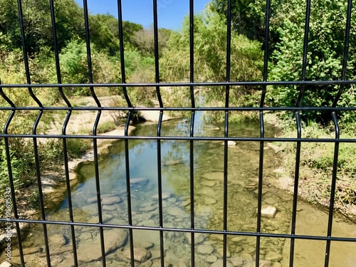 Natural Pool with a fence on a sunny summer day in the United States of America