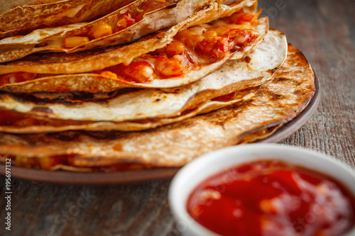 Mexican quesadilla, buritto or fajito and salsa sauce photo