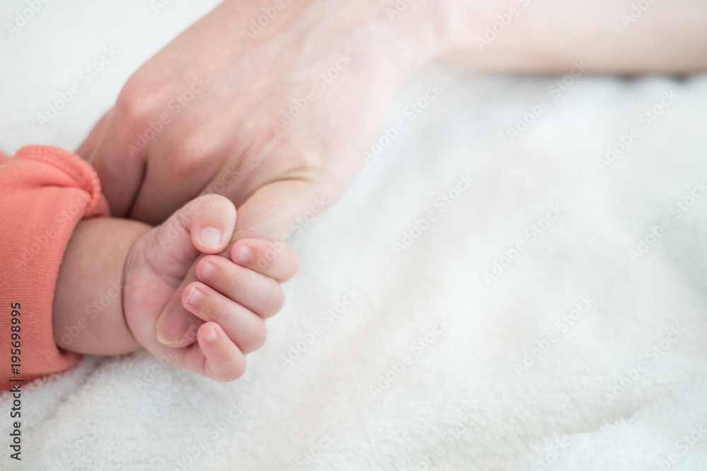 New Born Baby hand hold little finger of mom: concept of love, take care, parent relationship New Born Baby hand hold little finger of mom: concept of love, take care, parent relationship