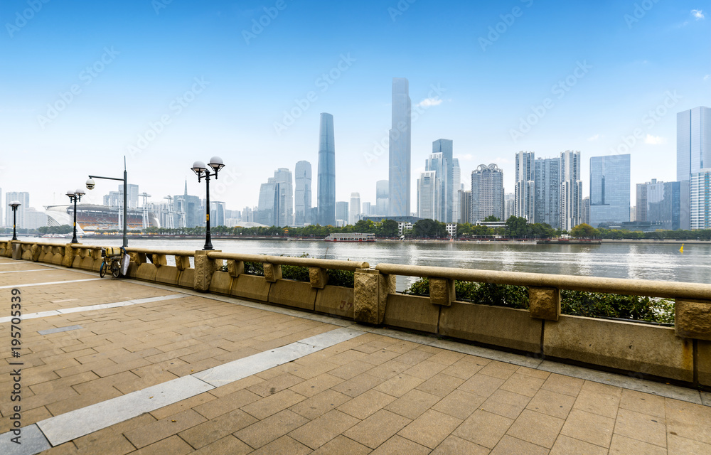 Panoramic skyline and buildings with empty concrete square floor in guangzhou,china