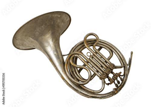 Old vintage rusty French horn on a withe background, isolated