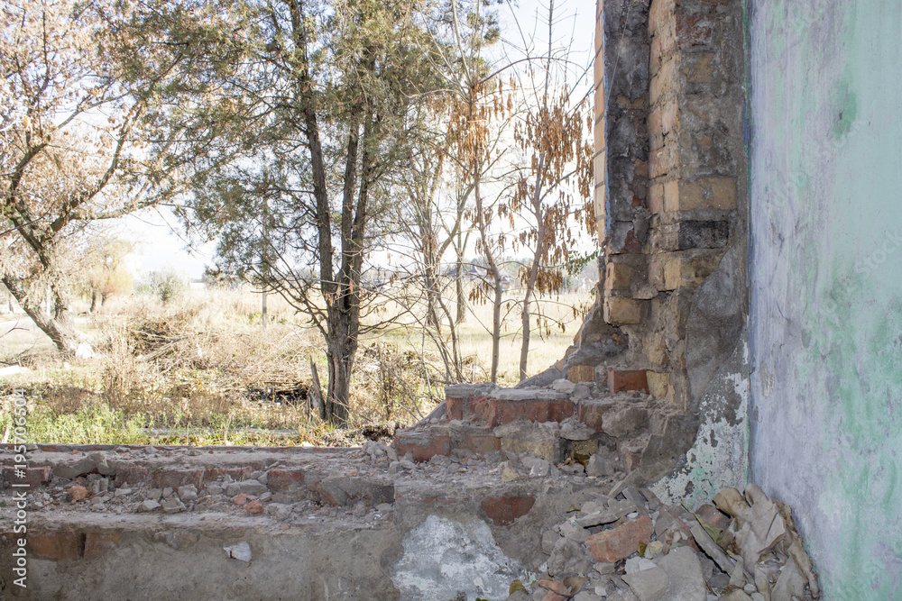 Abandoned building. Ruins of the river port in one of the cities in Eastern Europe. Destroyed brick wall. Abandoned building. Ruins of the river port in one of the cities in Eastern Europe. Destroyed brick wall.