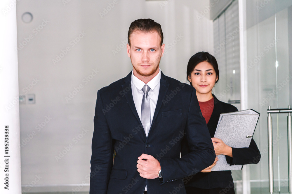 Portrait of handsome man in blue suit standing outdoors Portrait of handsome man in blue suit standing outdoors