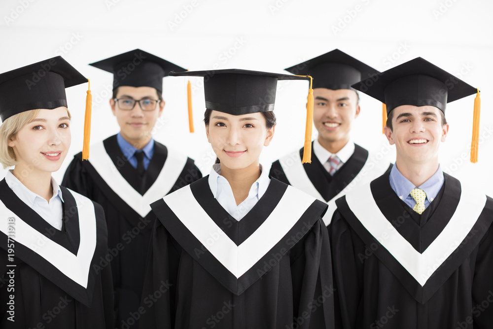 smiling college graduate at graduation with classmates smiling college graduate at graduation with classmates