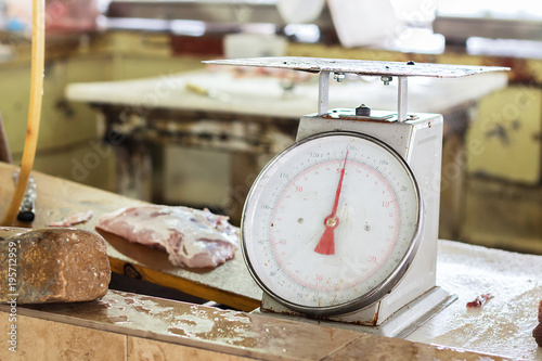 Small weight scale at a fish market.