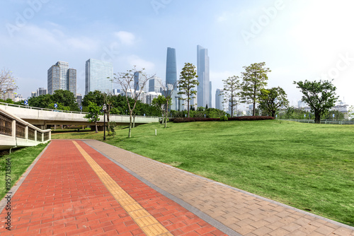 The path in the park and the modern city building in Guangzhou, China