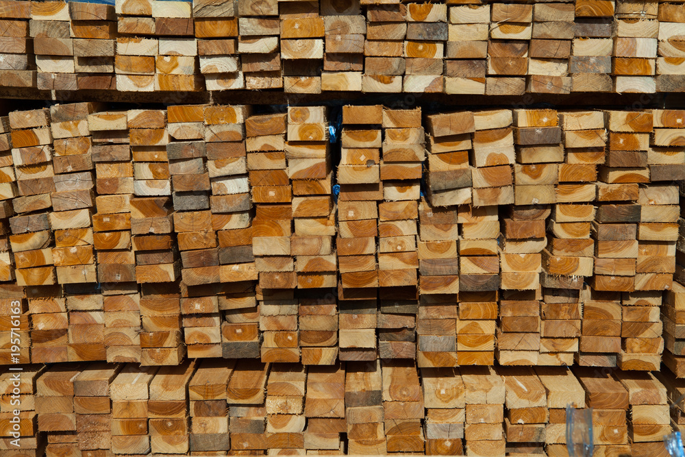 Stack of teak wood in lumber yard. pile Wooden Stack of teak wood in lumber yard. pile Wooden