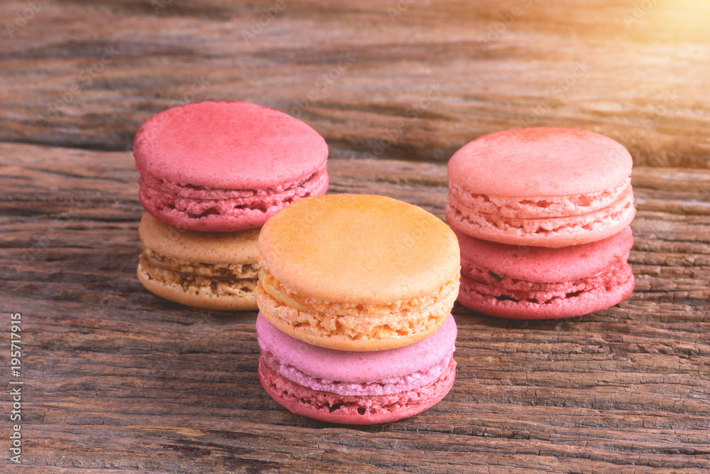 Fototapeta premium Different types color of macaroons on Old grunge wooden background