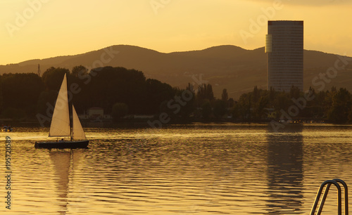 sailboat on water at sunset. Vienna, Austria