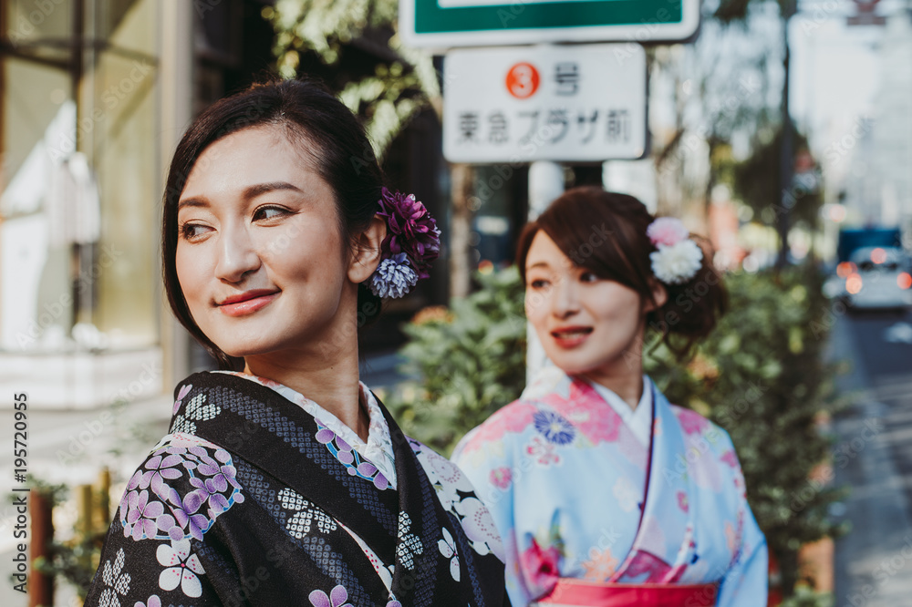 Two japanese girls wearing kimonos traditional clothes, lifestyle moments Two japanese girls wearing kimonos traditional clothes, lifestyle moments