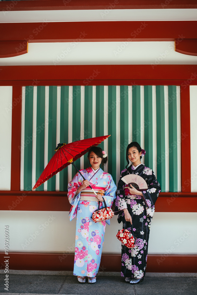 Two japanese girls wearing kimonos traditional clothes, lifestyle moments Two japanese girls wearing kimonos traditional clothes, lifestyle moments