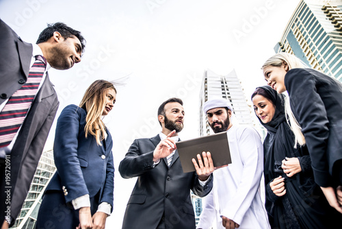 Photography Arabic and western business people speaking about investments