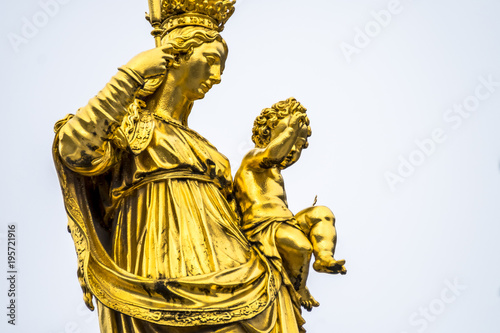 Golden statue of the Virgin Mary in the city center of Munich, Germany