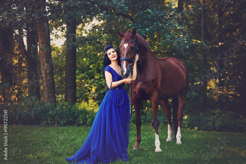 beautiful girl in dress with horse