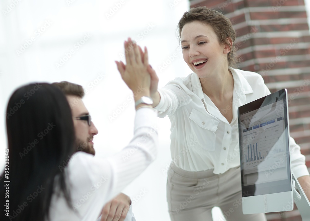 joyful colleagues show their success by giving each other 