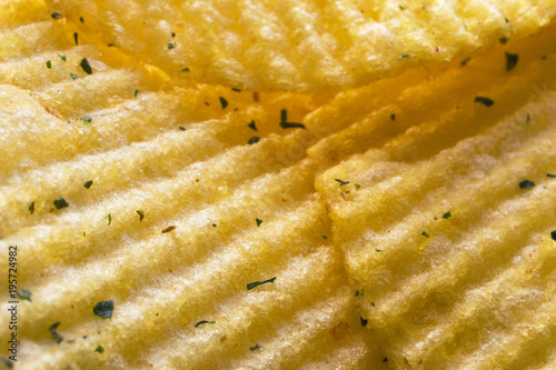 Yellow potato chips, macro photography, texture