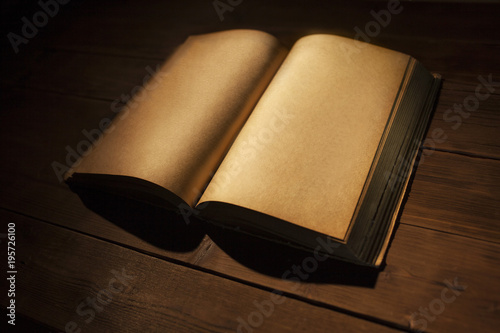 Wallpaper Mural open magic old book on wooden background Torontodigital.ca