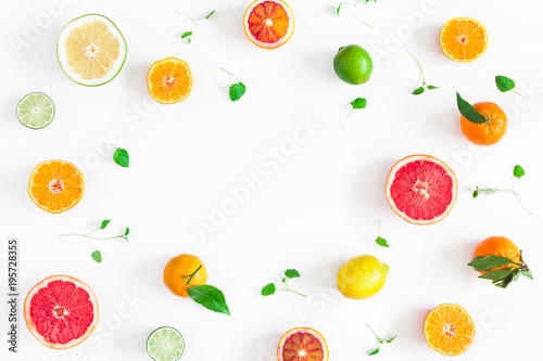 Fototapeta Naklejka Na Ścianę i Meble -  Fruit background. Colorful fresh fruits on white table. Orange, tangerine, lime, lemon, grapefruit. Flat lay, top view, copy space