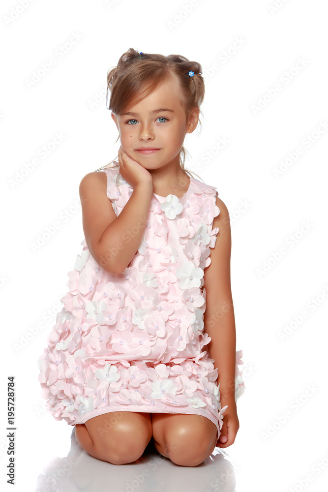 Little girl is sitting on the floor. Little girl is sitting on the floor.