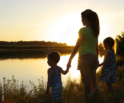 Mother and children near the lake