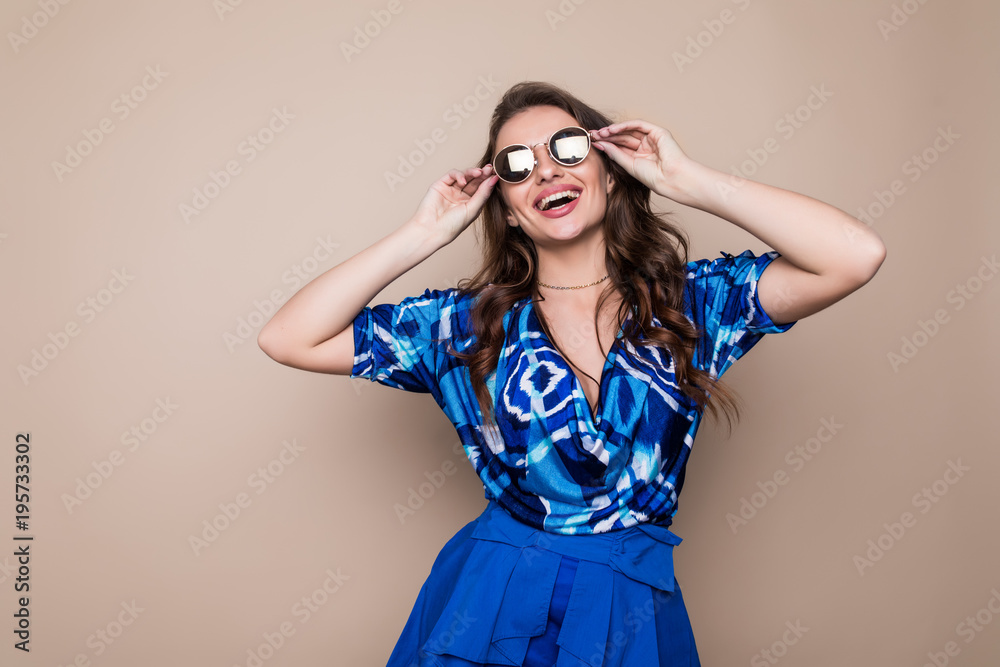 Pretty young sexy fashion sensual woman posing on color wall background. Stylish fashionable blonde girl summer clothes. Pretty young sexy fashion sensual woman posing on color wall background. Stylish fashionable blonde girl summer clothes.