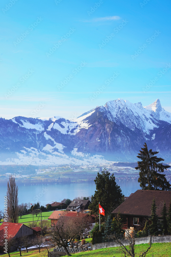 Sigrilwil village at Swiss Alpine mountains with Thun lake