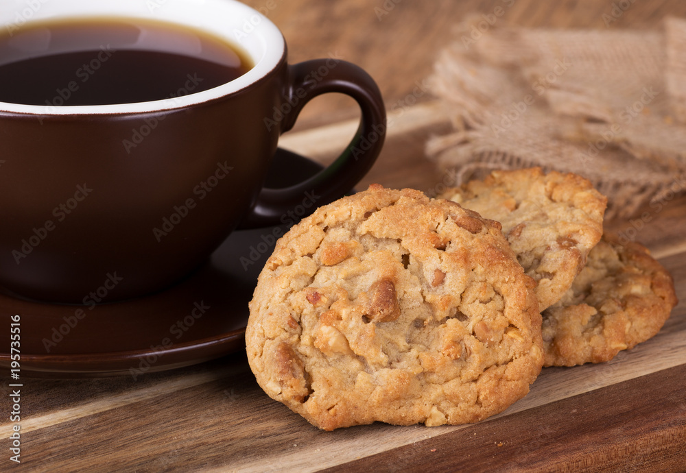 Peanut butter cookies next to a cup of coffee Peanut butter cookies next to a cup of coffee