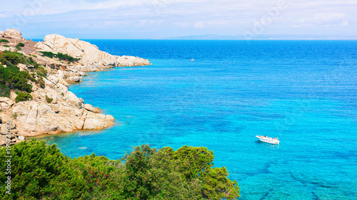 Boat in Mediterranian Sea in Capo Testa photo