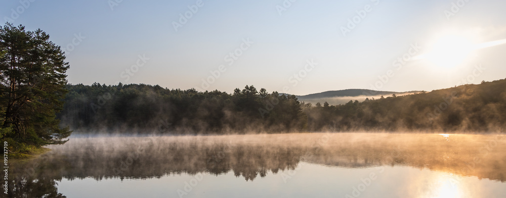 Gorgeous sunrise over pond with mountain views panorama Gorgeous sunrise over pond with mountain views panorama