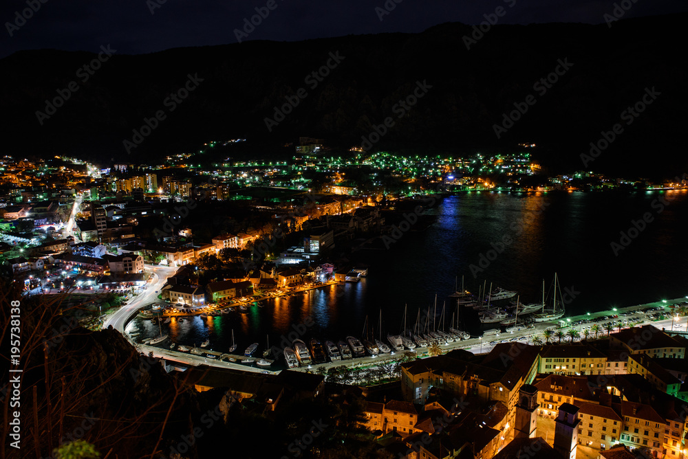 Fototapeta premium Night view of Kotor Fortress wall with heart-shape reflection