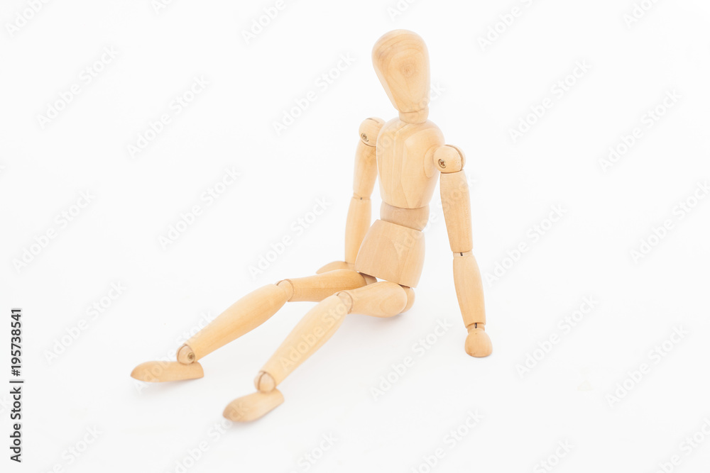 The wooden dummy is sad. On a white background. The wooden dummy is sad. On a white background.
