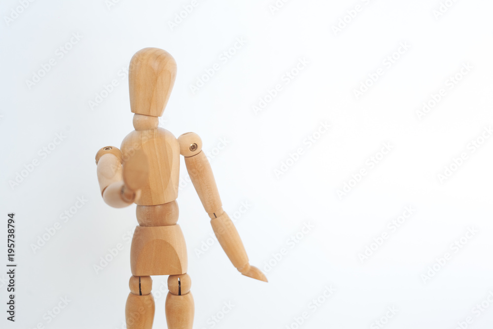 A wooden dummy shows a stop. On a white background. A wooden dummy shows a stop. On a white background.