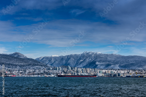 Tanker and Rocky Mountains, North Vancouver, British Colombia, Canada.