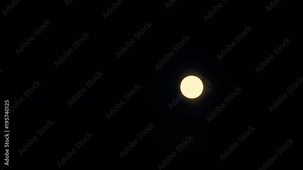The moon moves through the night sky. Timelapse The moon moves through the night sky. Timelapse