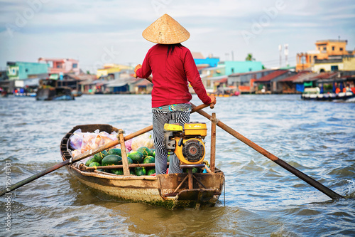 Obraz na płótnie Woman selling watermelon at Floating market at Mekong Can Tho