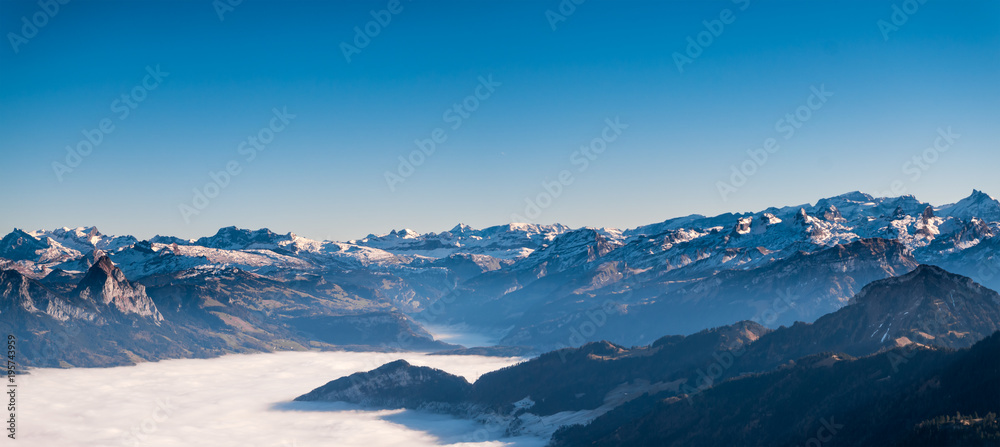 Panorama view of Swiss Alps mountain with mist/foggy in the winter time. A view from Rigi kulm, Lucerne, Switzerland..