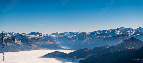 Panorama view of Swiss Alps mountain with mist/foggy in the winter time. A view from Rigi kulm, Lucerne, Switzerland..