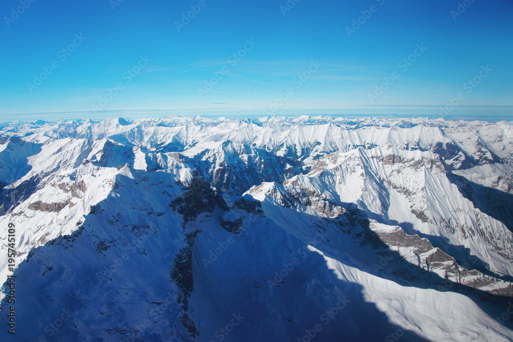 Mountain peaks ridge winter Swiss Alps helicopter view