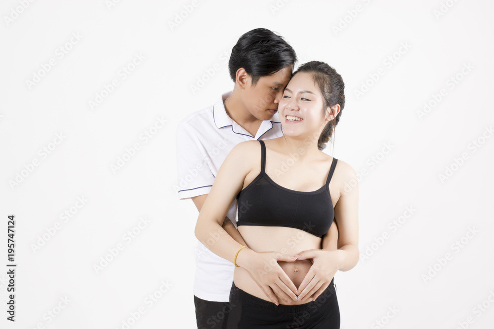 Beautiful pregnant woman and her handsome husband hugged her belly. Beautiful pregnant woman and her handsome husband hugged her belly.