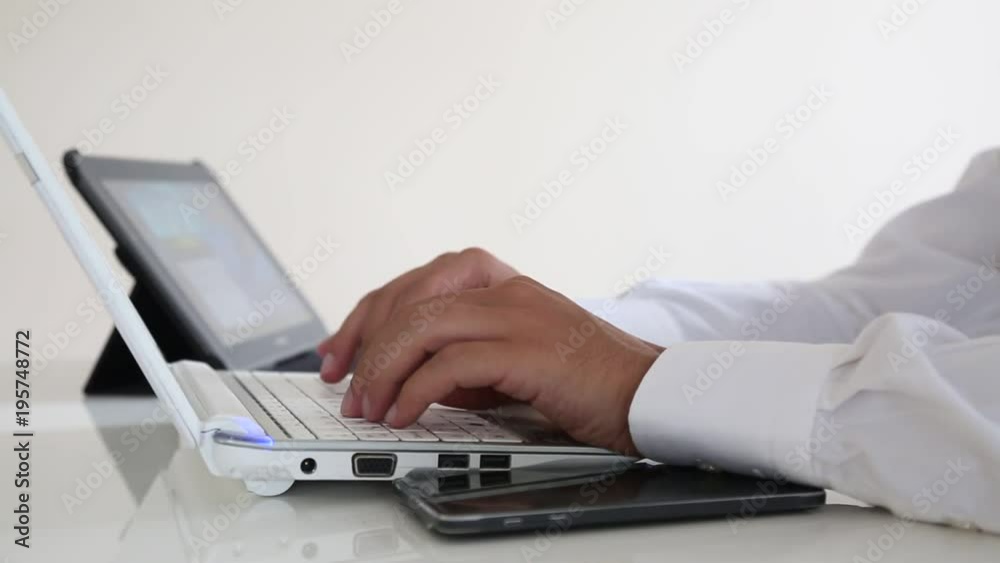 Using laptop writing online and tablet Using laptop writing online and tablet