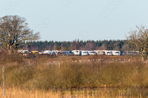 Parked campers at Hornborgasjon in the spring in Sweden photo