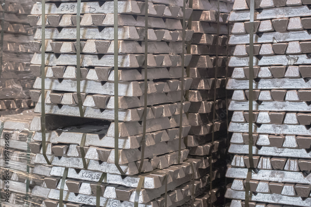 Sticker Close up of Aluminum on pallet Ingot storage in indoor warehouse for export as industrial background