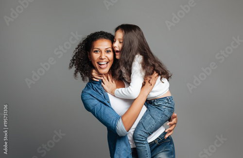 Overjoyed mother holding her daughter