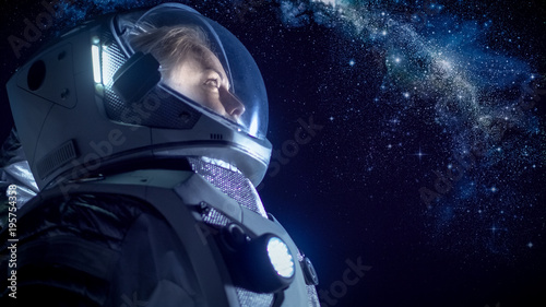 Fototapeta Naklejka Na Ścianę i Meble -  Portrait of the Beautiful Female Astronaut on the Alien Planet Looking at the Milky Way Galaxy. Space Travel, Exploration and Solar System Colonization Concept.