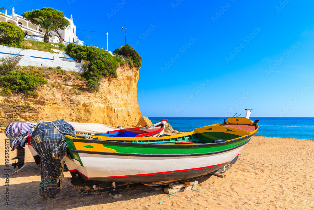 Fishing boats on beach in Carvoeiro town in Algarve region, Portugal