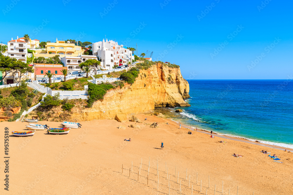 Beach with fishing boats in Carvoeiro town, Algarve, Portugal