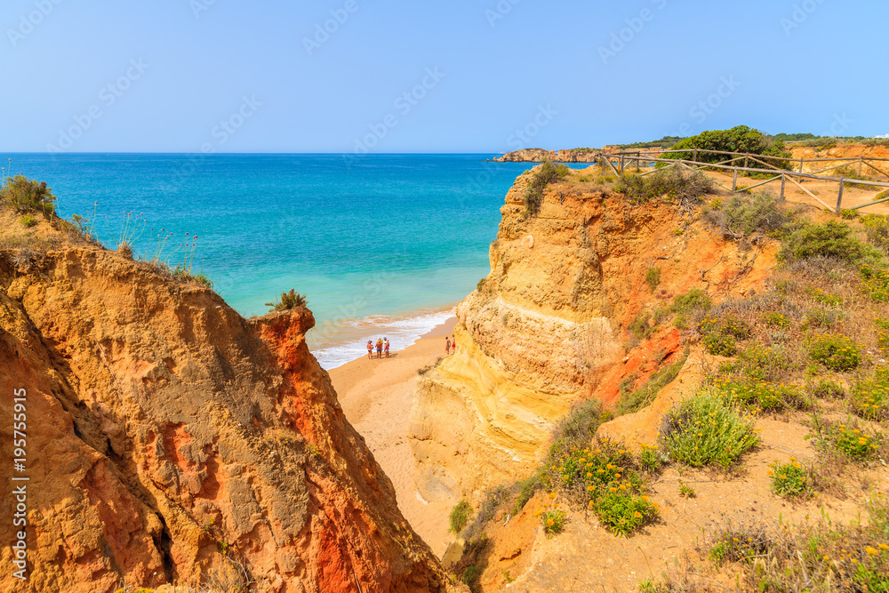 Sandy Praia da Rocha beach with golden color rocks in Portimao town, Portugal